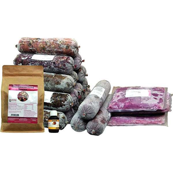 Ein Probierset mit mehreren Frostfleischrollen in durchsichtigem Kunstdarm, flachen Fleischbeuteln, einer braunen Papiertüte und einem kleinen Fläschchen mit Öl.